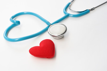 Red heart with stethoscope isolated on white background
