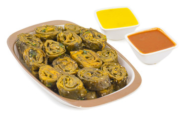 Indian Spicy Food Patra Also Called Paatra, Alu Vadi or Patrode is a Veg Dish in Maharashtra or Gujarati Cuisine. It is Made from Colocasia Leaves Stuffed with Rice Flour And Spices, Tamarind, Jaggery