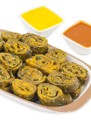Indian Spicy Food Patra Also Called Paatra, Alu Vadi or Patrode is a Veg Dish in Maharashtra or Gujarati Cuisine. It is Made from Colocasia Leaves Stuffed with Rice Flour And Spices, Tamarind, Jaggery