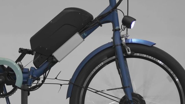 Electrobike wheel spinning, exhibition of exclusive bicycles, eco transport