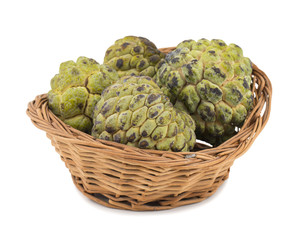 Fototapeta premium Sweet And Healthy Fruit Custard Apple Also Know as Sitafal, Sweetsop, Annona Squamosa, Sugar Apple, Sitaphal or Anona in Basket isolated on White Background