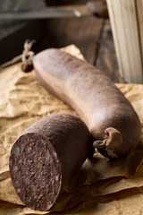 German specialty blood sausage (Blutwurst) on wooden table