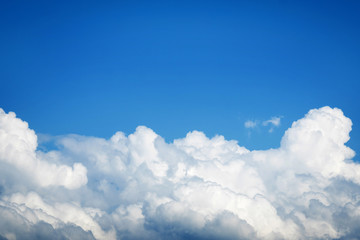 Fototapeta na wymiar white cumulus clouds on blue sky background