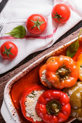 homemade, stuffed peppers. with a filling of basil, spinach, cheese and spices. with gravy from fresh home-made tomatoes. made in a rustic style.