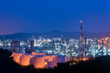 Aerial view Oil refinery.Industrial view at oil refinery plant form industry zone with sunrise and cloudy sky. and Petrochemical background sunset.
