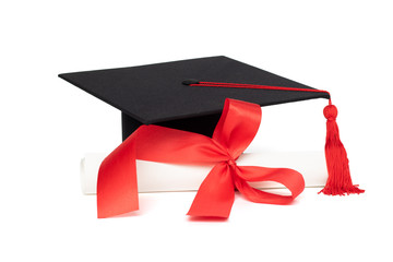 Graduation cap and certificate with red tassel isolated on white background