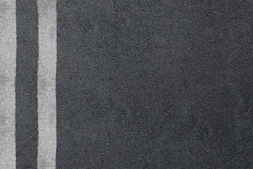 Fototapeta premium Asphalt road with separation lines. Highway texture