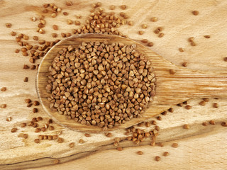Buckwheat in wooden spoon