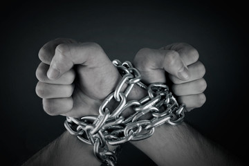 hands tied with chains