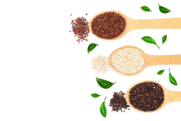 Black red white quinoa seeds in wooden spoon with leaves isolated on white background with copy space for your text