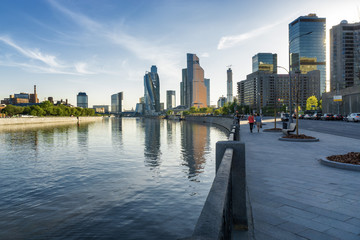 Sunny view of Smolenskaya embankment and Moskva river, Moscow, Russia.