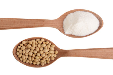 soybeans and dried soy milk in wooden spoon isolated on white background top view