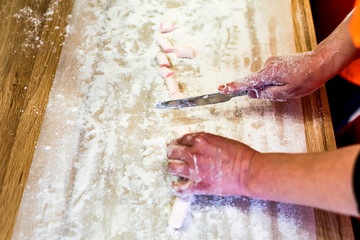 Woman hands cut white marshmallow