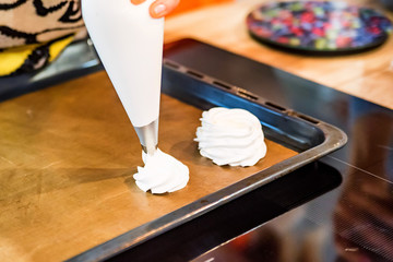 Making tasty meringues with pastry bag