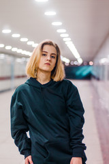 beautiful young blonde girl in an underpass