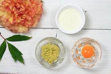 Facial or hair mask from avokado, egg,  yogurt / Alternative medicine concept, homemade mask from edible ingredient,