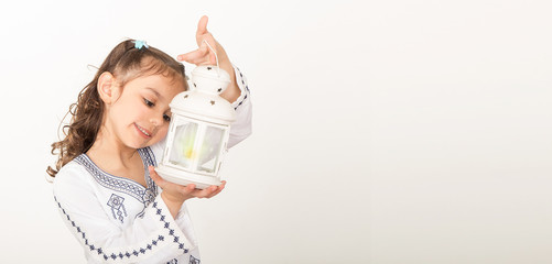 Greeting Card : Happy young Muslim girl playing with lantern in Ramadan