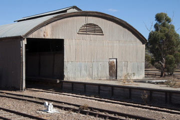 Fototapeta na wymiar Quorn South Australia, view of corrugated iron rail shed at the end of the platform