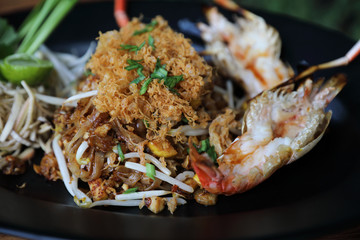 Shrimp pad thai noodles with shrimps on top , Thai food