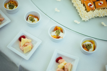 table set with plates of canapés for reception and wedding party