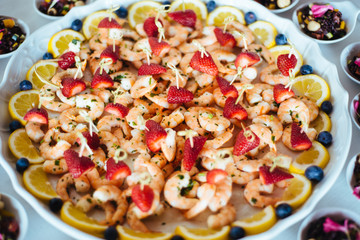 dish with shrimp and strawberries appetizers for festive lunch