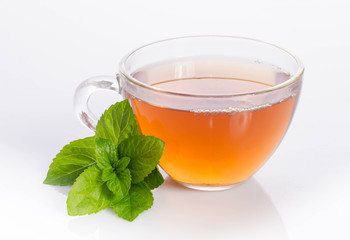 Glass cup of Tea with mint leaves  on table