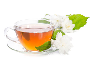 Glass cup of Tea with jasmine flowers and leaves isolated on white background