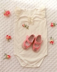 Concept of children's clothing with roses for girl.