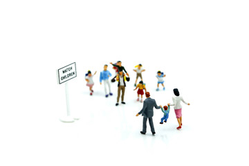 Fototapeta na wymiar Miniature people : student or children crossing road on way to school,Back to school concept.