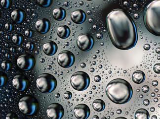 Colored Water Drops on smooth glass surface