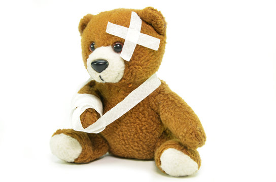 Injured teddy bear with bandages