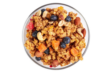 Bowl of homemade granola with fruit pieces isolated on white