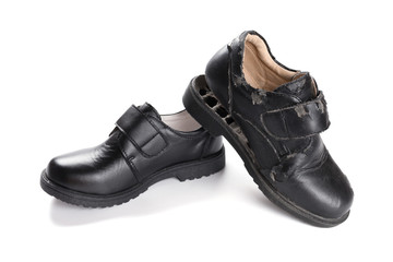 a new leather shoe and a damaged old one on white