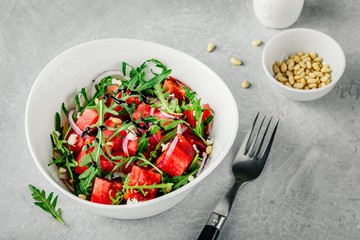 Watermelon with feta, arugula, onion, pine nuts and balsamic sauce.