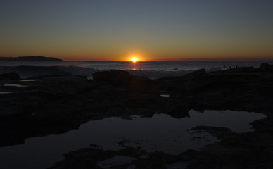 Fototapeta premium Beautiful Morning sunrise across Dee Why Rock Pool