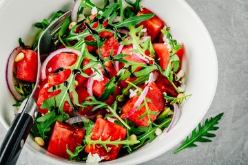 Watermelon with feta, arugula, onion, pine nuts and balsamic sauce.