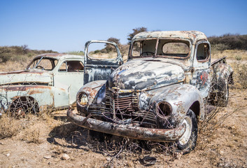 Abandoned classic cars rusting in Namib desert, Namibia