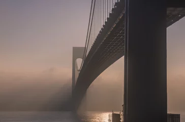 Fotobehang Amazing view of the bridge in the fog © TetyanaOhare