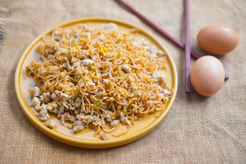 Stir fried instant noodle with mixed pork and egg