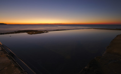 Beautiful Morning sunrise across Dee Why Rock Pool