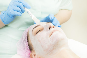 Massage and facial peels at the salon using cosmetics 