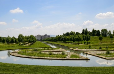 Venaria reale, Piedmont region, Italy. June 2017. The landscape of the gardens of the royal palace of Venaria. Vision from the ruins of the temple of Diana towards the palace. Tourists.