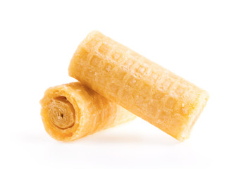 Gtoup of tasty crispy wafer rolls isolated on white background