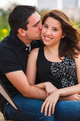 Young couple outdoor portrait in a downtown urban park