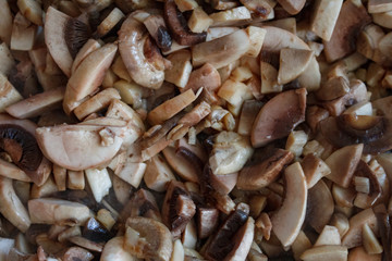 Champignon mushrooms, sacking mat and spices on wooden background