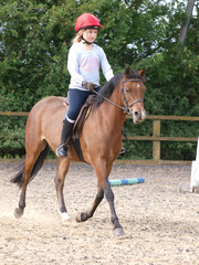 Young Girl Enjoying Horse Riding