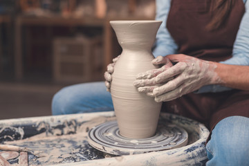 Young couple with a potter's wheel