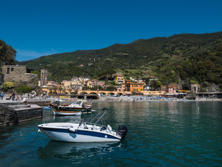 Fototapeta na wymiar Monterosso village, bay and boats on a sunny spring day