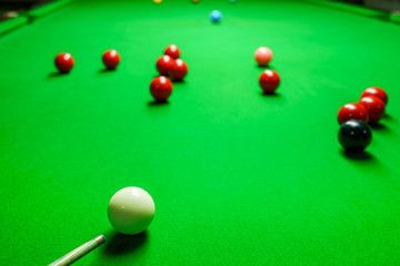 Player was shooting ball on green snooker table