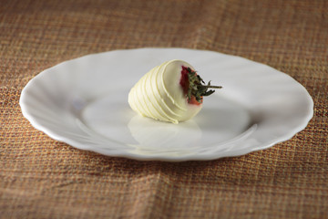 Strawberries covered in milk chocolate, delicious dessert for business man.